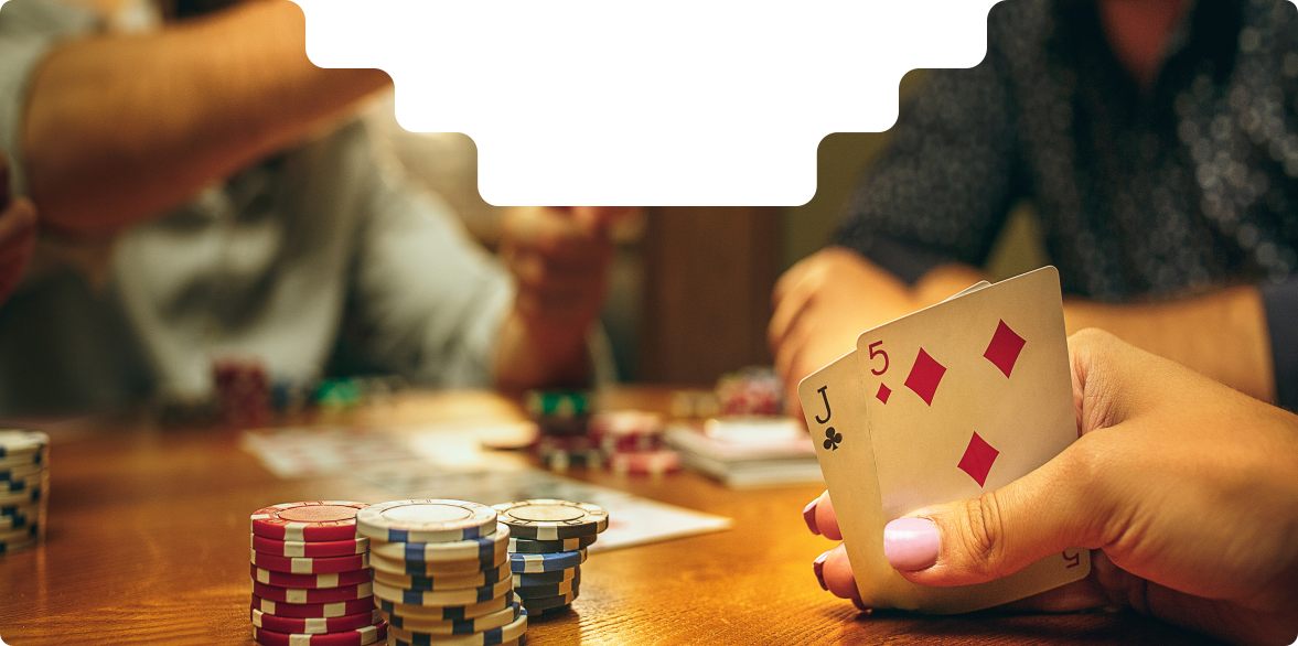 Group of people playing poker with chips on the table